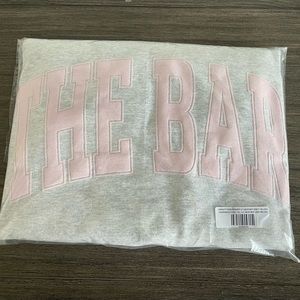 The Bar Varsity Sweatshirt in light heather grey and blush pink XL
